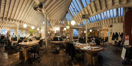 The co-working space: a shared working environment. Photograph by Impact Hub used here under Creative Commons licence. 